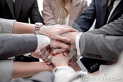 Close up.a focused business team putting their hands together Stock Photo