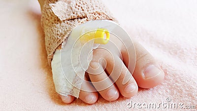 Close-up foot of child patient with saline solution drip Stock Photo