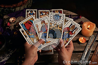 Close-up of a fortune teller reading tarot cards Stock Photo