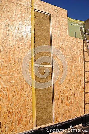 Close up on frame house wall construction. Structural Insulated Panels (SIPS) with mineral woo Stock Photo