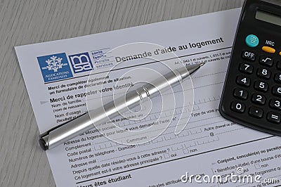 French housing assistance application form with pen and calculator Editorial Stock Photo