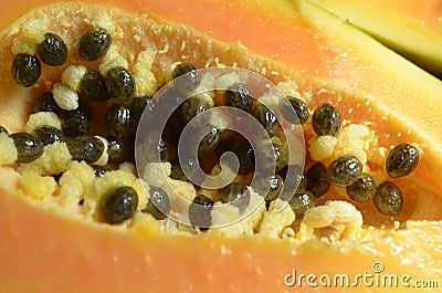 Close up of Fresh cut papaya halves with black seeds Stock Photo