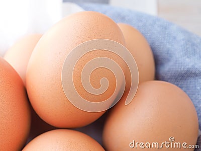 Close up fresh organic eggs on basket. High protein and Vitamin foods. Stock Photo