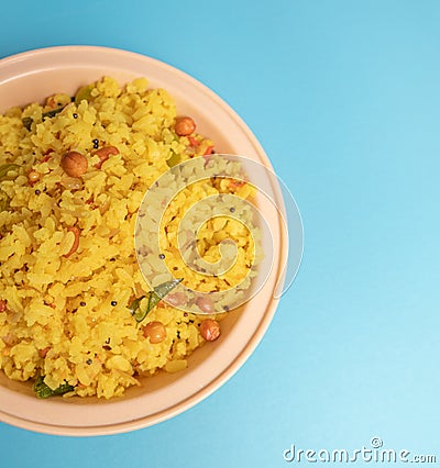 Close up of Fresh Poha or Pohy is a popular Indian breakfast on on bowl Stock Photo