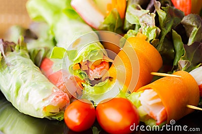 Close up of fresh salad of lettuce, cucumber and tomato on plate for healthy eating...Fresh vegetable salad in Black plate on Stock Photo