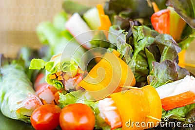 Close up of fresh salad of lettuce, cucumber and tomato on plate for healthy eating...Fresh vegetable salad in Black plate on Stock Photo