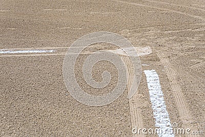Close up of freshly chalked baseline leading to home plate, dirt only, empty baseball field on a sunny day Stock Photo
