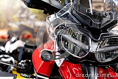 Close up of the front of a brand new enduro motorcycle, soft focus, abstract background - Image Stock Photo