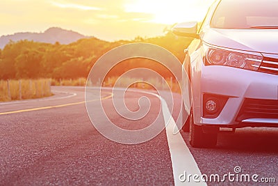 Front of new silver car parking on the asphalt road Stock Photo