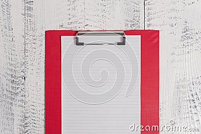 Close up front view colored clipboard blank paper sheet lying retro old wooden rustic vintage background at working Stock Photo