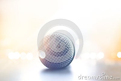 Close up front view of microphone in concert hall on floor stage Stock Photo