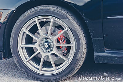 A close-up of the front wheel of the car brakes Editorial Stock Photo