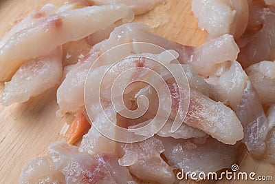 Frozen pangasius dory on wooden plate Stock Photo
