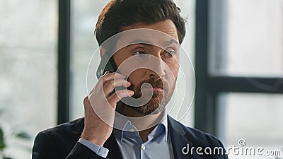 Close-up frustrated businessman aggressive loud talk on phone in office angry nervous man leader CEO discuss business Stock Photo