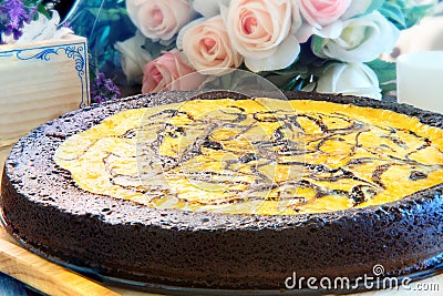 Close up full big pound of brownie cheese cake on wood plate dec Stock Photo