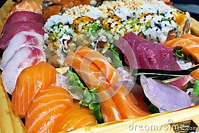 Close-up of full fresh sushi boat with salmon and raw fish unagi sake Stock Photo