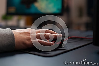 Close up of gamer holding mouse on mousepad Stock Photo