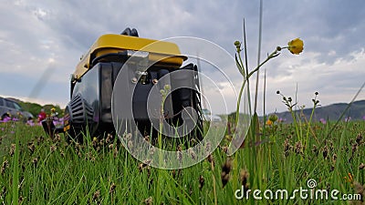 Close up of gas diesel mobile portable electricity generator work on grass. Gasoline fuel powered portable generator Stock Photo