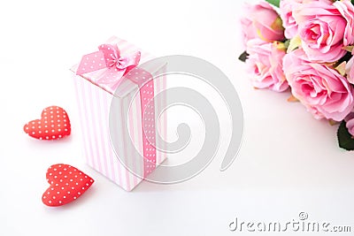Close up gift box on white background with pink roses and heart on white Stock Photo