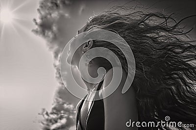 Close-up of a girl with long hair, portrayed from below Stock Photo