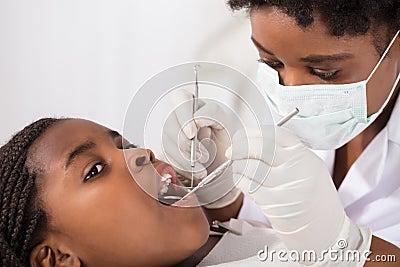 African Girl With Mouth Open During Oral Checkup Stock Photo