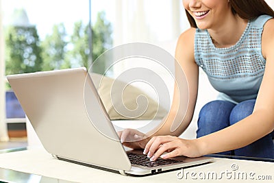 Close up of a girl typing in a laptop Stock Photo