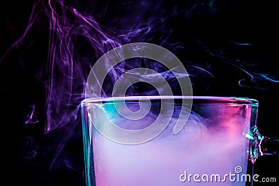 A glass with colorful smoke Stock Photo