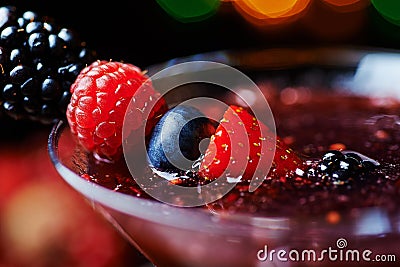 Close up glass of tropical cocktail with berries or lemonade. Stock Photo