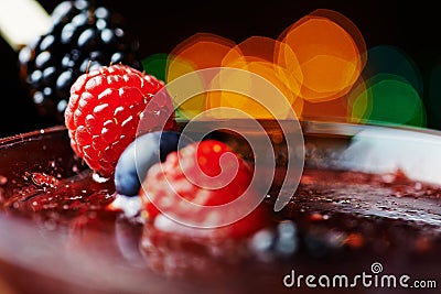 Close up glass of tropical cocktail with berries or lemonade. Stock Photo