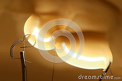 Close up glowing light bulb thread Stock Photo