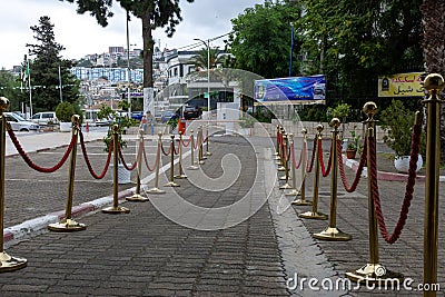 Close up of golden barriers with red rope. Editorial Stock Photo