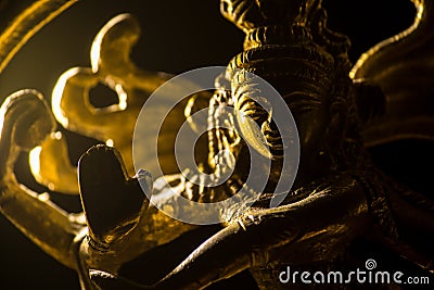 Close up of a golden idol of a Hindu god Stock Photo