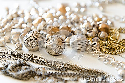 Close up golden necklaces and chains.Hand made metal jewelry elements flat lay Stock Photo