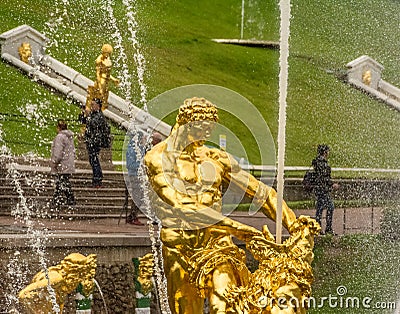 Saint Petersburg, Russia - 18 Sep, 2017: Golden Statue of man wrestling with a lion. Editorial Stock Photo