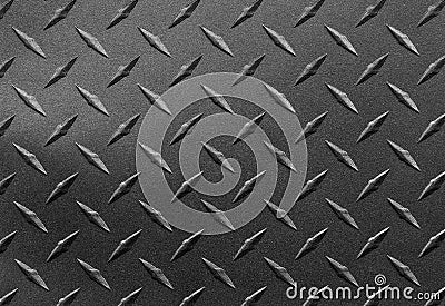 Close up of grainy textured steel sheet with diamond plate pattern, metallic background Stock Photo