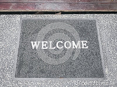 Close-up Gray Mat with White Welcome Text Label Stock Photo