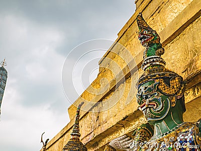 Close up Green Giant Lift golden Pagoda in Wat Phrakaew temple Bangkok Thailand. Stock Photo