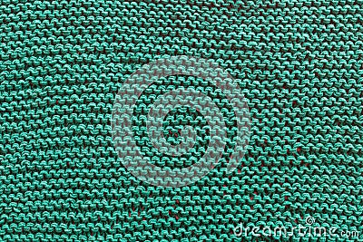 A close-up of a green knitted sweater. Stock Photo