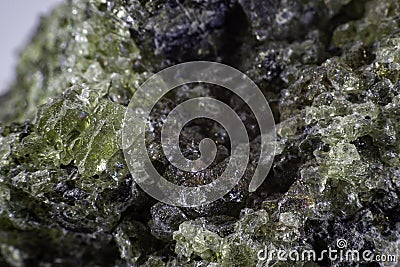 Close up on a green olivine mineral. Stock Photo