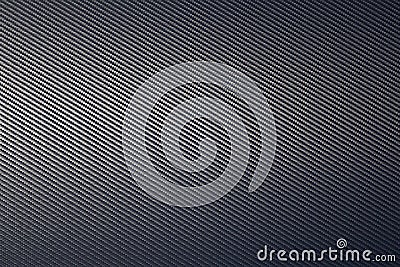 Close up of grey diagonal oriented woven carbon fibre sheet surface Stock Photo