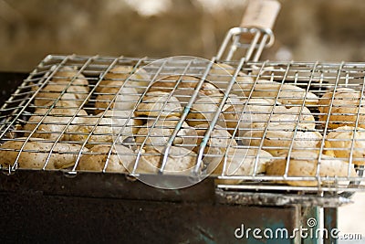 Potatos grilled in gridiron Stock Photo