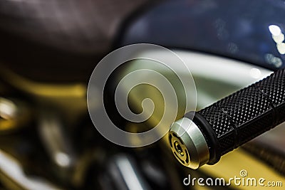 Close up of grip on handlebar on a sport motorcycle. Handle bars motorcycle on blurred background. Selective focus for background Stock Photo