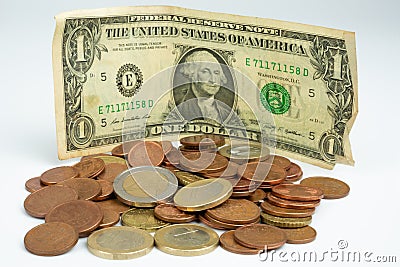 Close up of group of euro coins with a US dollar bill Stock Photo