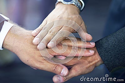 Close up of hispanic business man joining hands Stock Photo