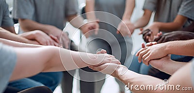 Close up. a group of people holding each other`s hands Stock Photo