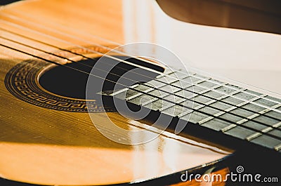 Close-up of guitar strings in sunlight Stock Photo