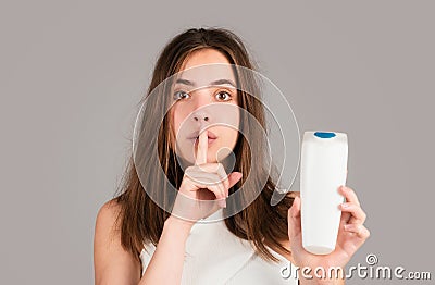 Close up hair loss problem treatment, baldness. Woman with bootle shampoo. Stock Photo