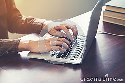 Close up hand business typing computer laptop in the office with Stock Photo