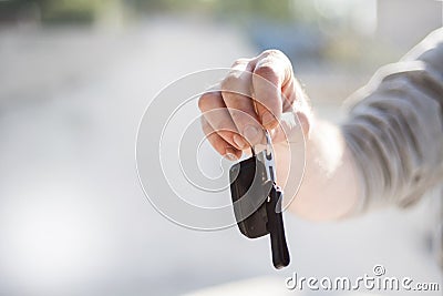 Close up hand of businessman man holding and give the remote control car systems. Stock Photo