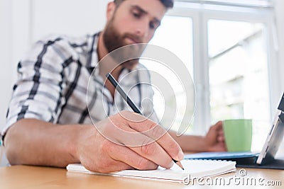 Close-up of the hand of a creative young man during freelance wo Stock Photo